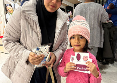 A mother and daughter visit the Nurture Nebraska booth.