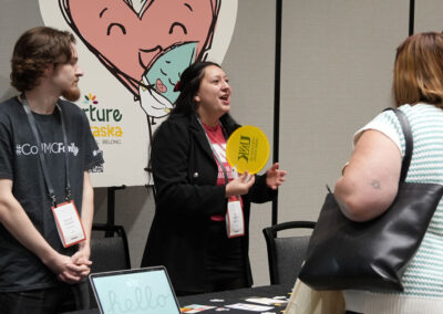 Jacht students interact with conference attendees at Nurture Nebraska booth.